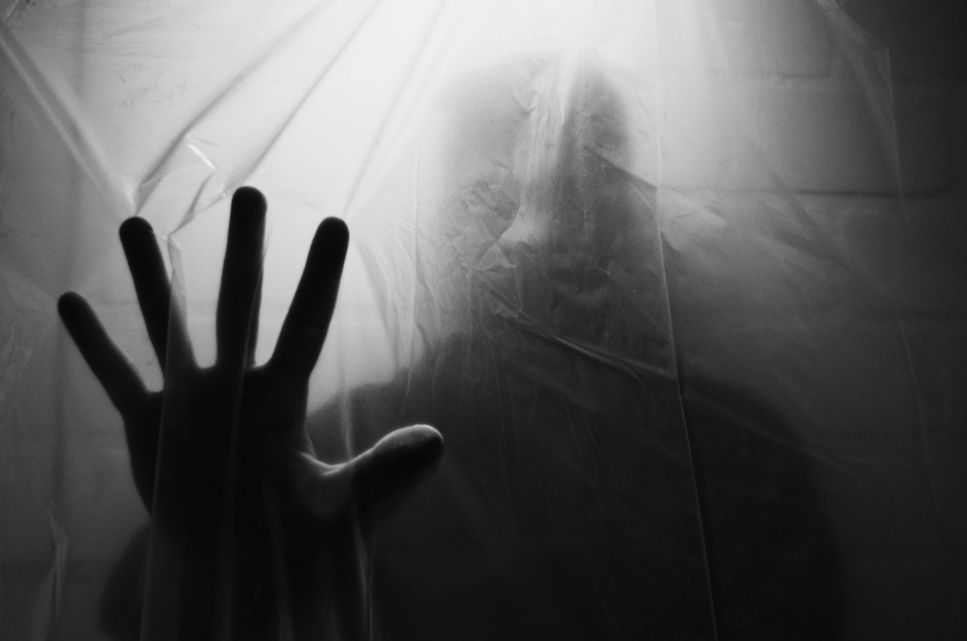 Eerie ghostly figure against screen